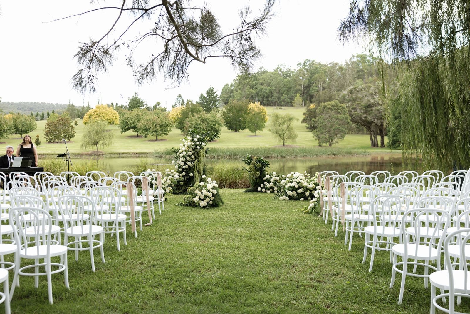 Rows of ghost chairs set for a wedding ceremony at a Hunter Valley venue