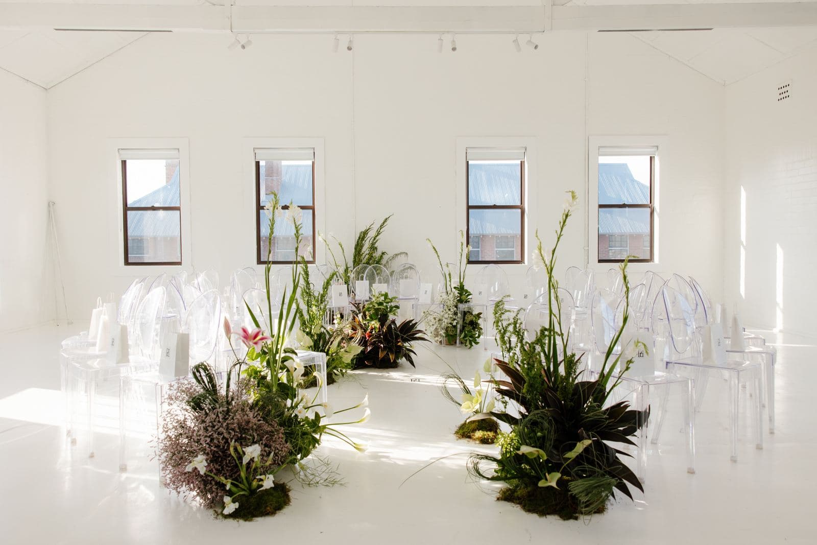 Ghost chairs arranged for a corporate launch event in a Newcastle studio